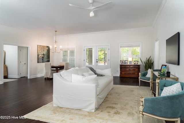 10 Linville Dr, Pinehurst, NC 28374 - living room featuring a chandelier, wood finished floors, crown molding, ceiling fan, and baseboards
