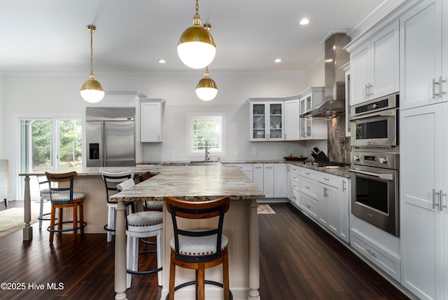 10 Linville Dr, Pinehurst, NC 28374 - kitchen featuring stainless steel appliances, extractor fan, a sink, a center island, and tasteful backsplash