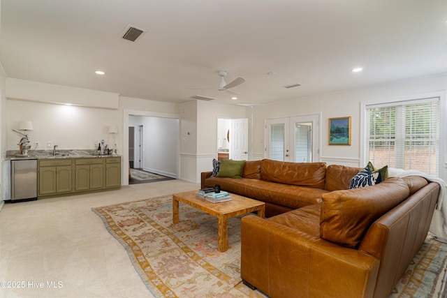 10 Linville Dr, Pinehurst, NC 28374 - living room featuring french doors, a ceiling fan, light carpet, bar with sink, and recessed lighting