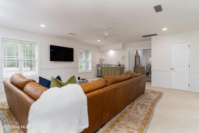 10 Linville Dr, Pinehurst, NC 28374 - living area with healthy amount of natural light, light colored carpet, ceiling fan, recessed lighting, and a wainscoted wall