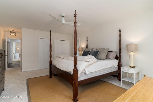 10 Linville Dr, Pinehurst, NC 28374 - bedroom featuring multiple closets, a ceiling fan, and light colored carpet