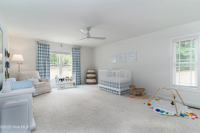 10 Linville Dr, Pinehurst, NC 28374 - bedroom featuring a nursery area, carpet, baseboards, and a ceiling fan