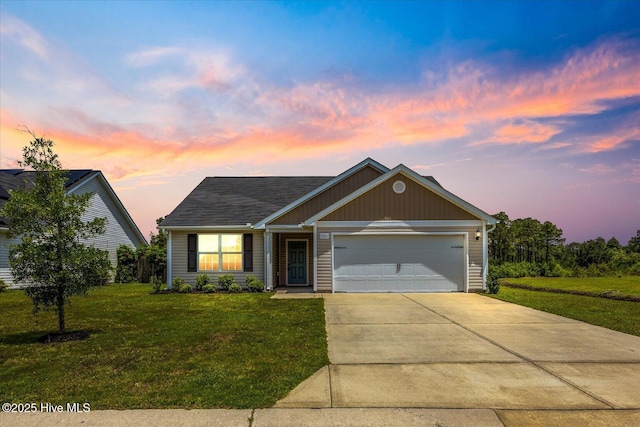 7213 Cameron Trace Dr, Wilmington, NC 28411 - view of front facade featuring driveway, a lawn, and a garage