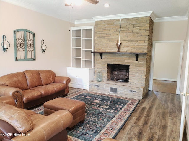 3902 Little John Dr N, Wilson, NC 27896 - living room with a ceiling fan, wood finished floors, crown molding, and a fireplace
