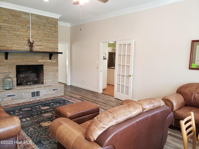 3902 Little John Dr N, Wilson, NC 27896 - living area featuring ornamental molding, a ceiling fan, wood finished floors, a fireplace, and baseboards