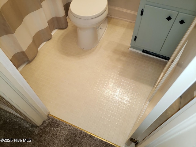 3902 Little John Dr N, Wilson, NC 27896 - bathroom view of toilet and baseboards