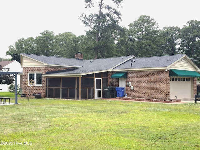 3902 Little John Dr N, Wilson, NC 27896 - rear view of property with brick siding, a yard, a sunroom, a garage, and a chimney