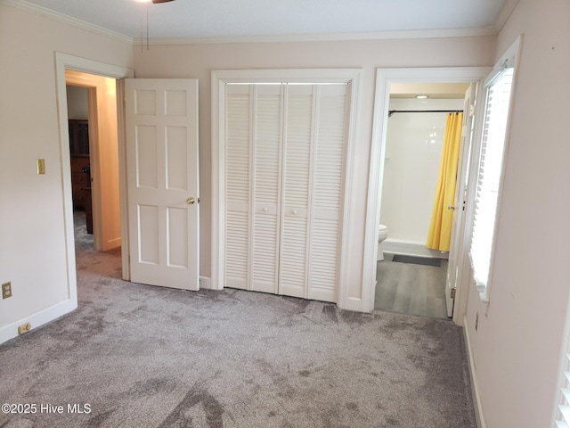 3902 Little John Dr N, Wilson, NC 27896 - unfurnished bedroom featuring carpet flooring, ornamental molding, baseboards, a closet, and connected bathroom