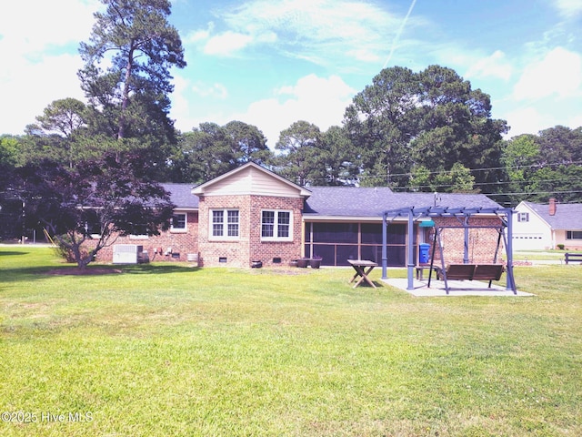 3902 Little John Dr N, Wilson, NC 27896 - back of house with a lawn, a patio, and brick siding