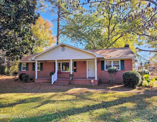 307 Neuse Cliffs Rd, New Bern, NC 28560 - view of front of house featuring a front lawn, brick siding, covered porch, and crawl space