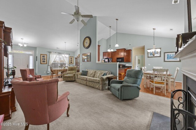 120 Leyland Way, Hampstead, NC 28443 - living area with a chandelier, a ceiling fan, light colored carpet, and high vaulted ceiling