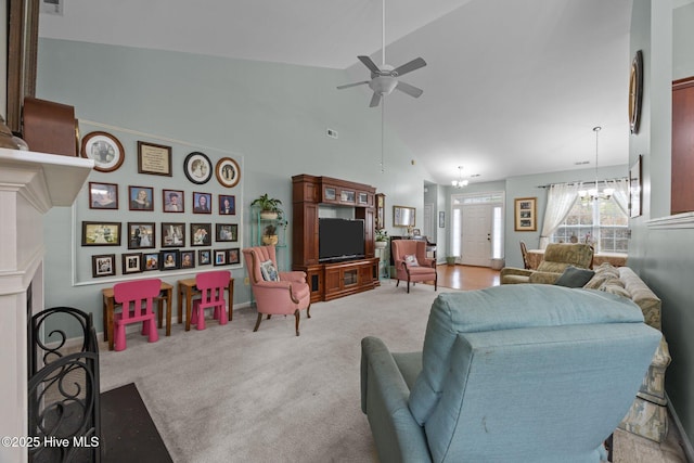 120 Leyland Way, Hampstead, NC 28443 - living area featuring a ceiling fan, a chandelier, high vaulted ceiling, and carpet floors