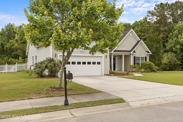 120 Leyland Way, Hampstead, NC 28443 - obstructed view of property with concrete driveway and a garage