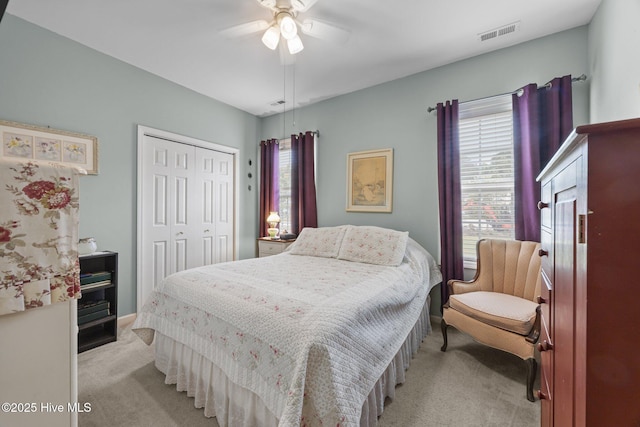 120 Leyland Way, Hampstead, NC 28443 - bedroom featuring light colored carpet, multiple windows, a closet, and ceiling fan