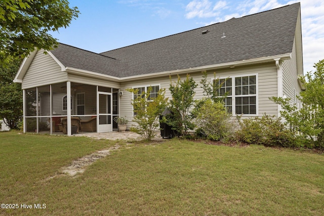 120 Leyland Way, Hampstead, NC 28443 - rear view of property featuring a sunroom, roof with shingles, and a lawn