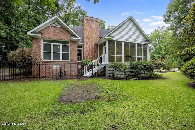 1501 Meridian Ter, Wilmington, NC 28411 - back of property featuring a sunroom, a chimney, and brick siding
