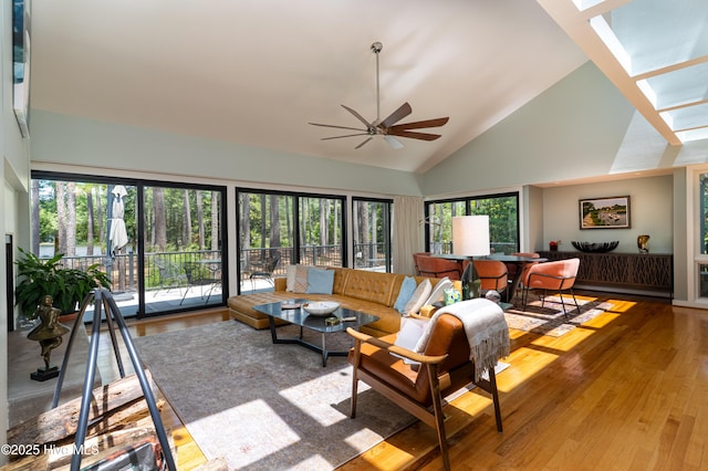 185 Ponte Vedra Dr, Pinehurst, NC 28374 - living area with a skylight, wood finished floors, high vaulted ceiling, and a ceiling fan