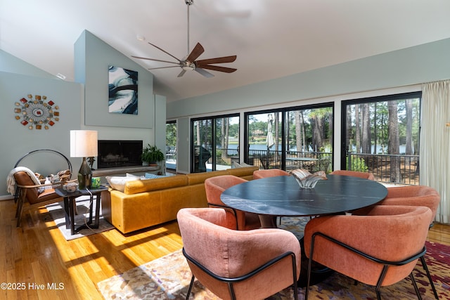 185 Ponte Vedra Dr, Pinehurst, NC 28374 - living room with ceiling fan, light wood-style flooring, healthy amount of natural light, a fireplace with raised hearth, and high vaulted ceiling