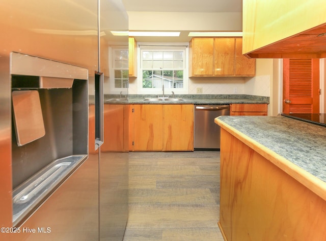 1710 Aydlett Cir, Elizabeth City, NC 27909 - kitchen featuring stainless steel dishwasher, a sink, tasteful backsplash, and dark countertops