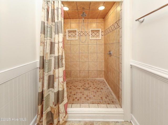 1710 Aydlett Cir, Elizabeth City, NC 27909 - bathroom featuring tiled shower and wainscoting