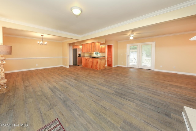 1710 Aydlett Cir, Elizabeth City, NC 27909 - unfurnished living room with a chandelier, crown molding, baseboards, dark wood-style floors, and a ceiling fan