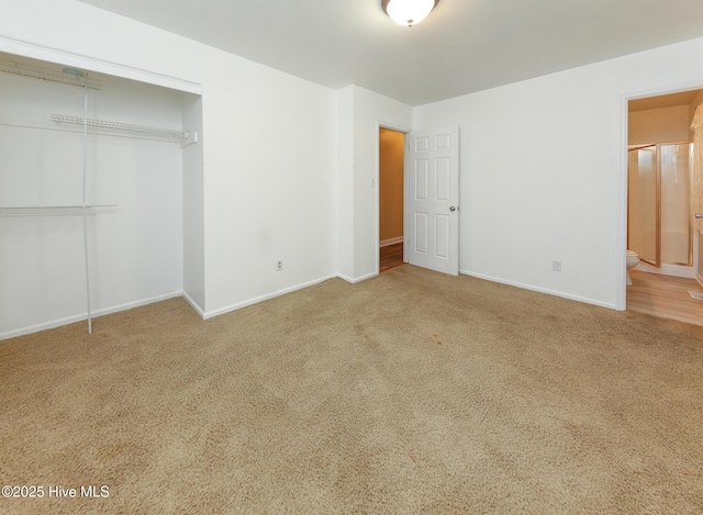 1710 Aydlett Cir, Elizabeth City, NC 27909 - unfurnished bedroom with carpet flooring, a closet, baseboards, and ensuite bathroom