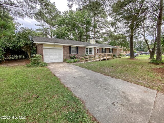 1710 Aydlett Cir, Elizabeth City, NC 27909 - ranch-style house with brick siding, driveway, a garage, a front yard, and a chimney