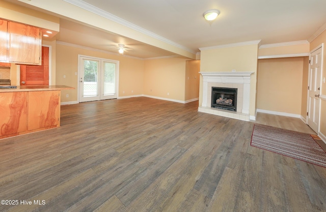 1710 Aydlett Cir, Elizabeth City, NC 27909 - unfurnished living room featuring dark wood finished floors, ornamental molding, ceiling fan, a tiled fireplace, and baseboards