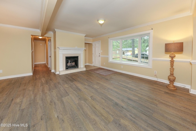 1710 Aydlett Cir, Elizabeth City, NC 27909 - unfurnished living room with wood finished floors, crown molding, a fireplace with raised hearth, and baseboards