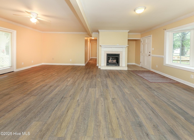 1710 Aydlett Cir, Elizabeth City, NC 27909 - unfurnished living room with wood finished floors, ceiling fan, baseboards, ornamental molding, and a tile fireplace