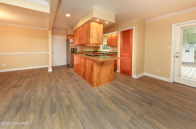 1710 Aydlett Cir, Elizabeth City, NC 27909 - kitchen featuring stainless steel fridge, baseboards, dark wood-type flooring, crown molding, and brown cabinets
