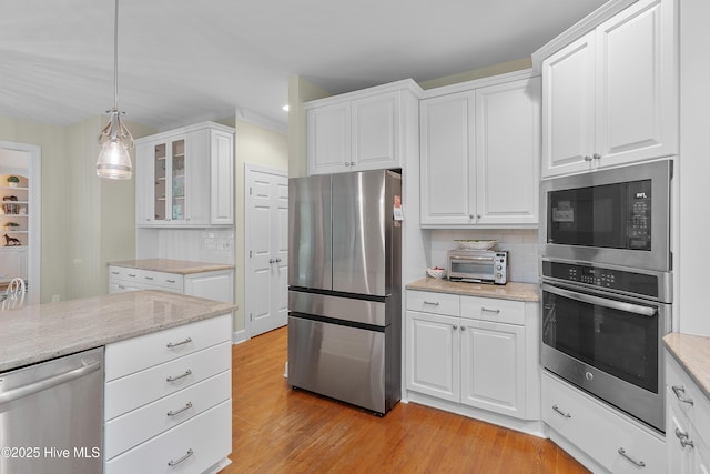 1012 Creekside Ln, Wilmington, NC 28411 - kitchen featuring appliances with stainless steel finishes, tasteful backsplash, white cabinets, and recessed lighting