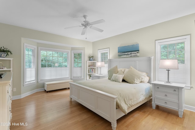 1012 Creekside Ln, Wilmington, NC 28411 - bedroom featuring multiple windows, light wood-style flooring, baseboards, and a ceiling fan