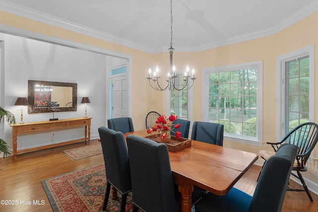1012 Creekside Ln, Wilmington, NC 28411 - dining space with a chandelier, wood finished floors, ornamental molding, and baseboards