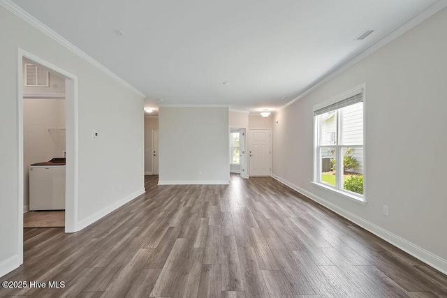 3200 Laughing Gull Ter, Wilmington, NC 28412 - unfurnished living room featuring wood finished floors, washer / clothes dryer, and crown molding