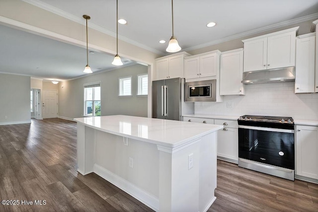 3200 Laughing Gull Ter, Wilmington, NC 28412 - kitchen featuring stainless steel appliances, under cabinet range hood, recessed lighting, a center island, and backsplash