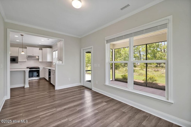 3200 Laughing Gull Ter, Wilmington, NC 28412 - unfurnished living room with dark wood-style floors and ornamental molding