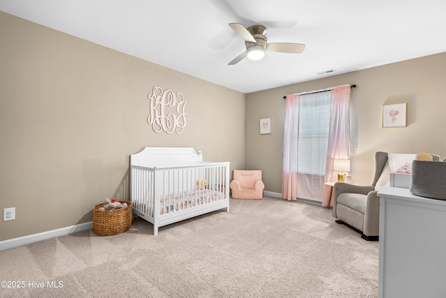 135 W Wellesley Dr, Clayton, NC 27520 - bedroom featuring carpet flooring, a nursery area, baseboards, and ceiling fan