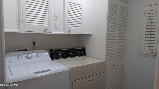 134 Mallards Cv, Vass, NC 28394 - laundry room with cabinet space and washing machine and clothes dryer