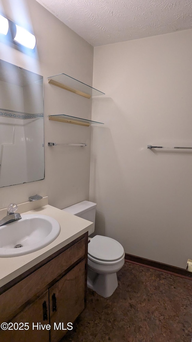 134 Mallards Cv, Vass, NC 28394 - bathroom featuring vanity, toilet, and a textured ceiling