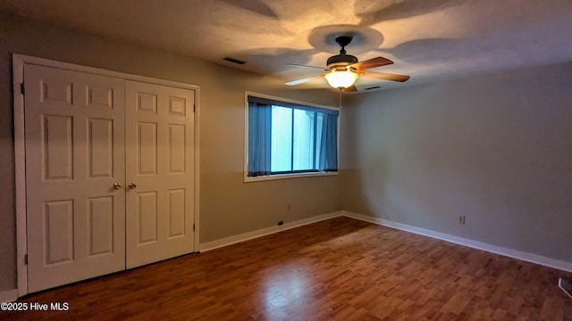 134 Mallards Cv, Vass, NC 28394 - unfurnished bedroom with wood finished floors, baseboards, a closet, and a ceiling fan
