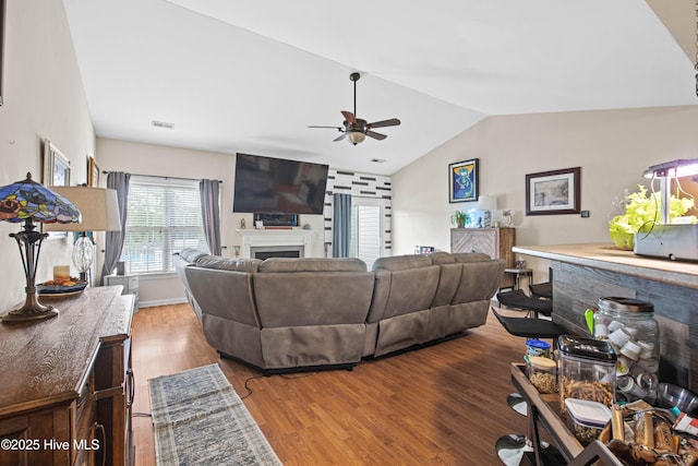 600 Pearson Cir, Newport, NC 28570 - living area with a ceiling fan, vaulted ceiling, wood finished floors, and a fireplace