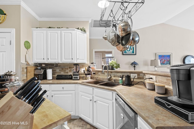 600 Pearson Cir, Newport, NC 28570 - kitchen with dishwashing machine, a sink, a chandelier, tasteful backsplash, and light countertops