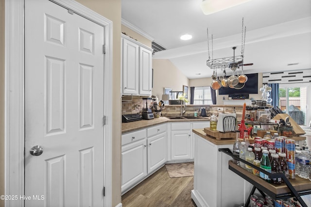 600 Pearson Cir, Newport, NC 28570 - kitchen with a sink, light wood-style floors, white cabinetry, healthy amount of natural light, and recessed lighting