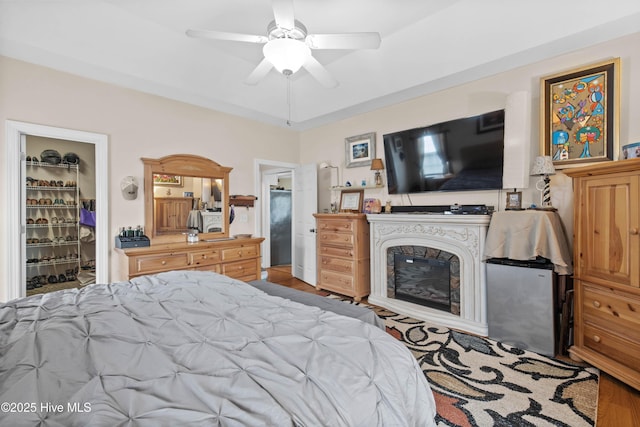 600 Pearson Cir, Newport, NC 28570 - bedroom featuring wood finished floors, a walk in closet, and a ceiling fan