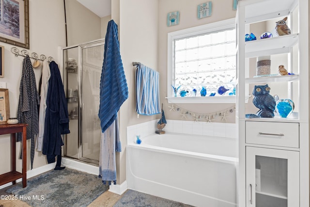 600 Pearson Cir, Newport, NC 28570 - bathroom with a stall shower, a bath, and baseboards