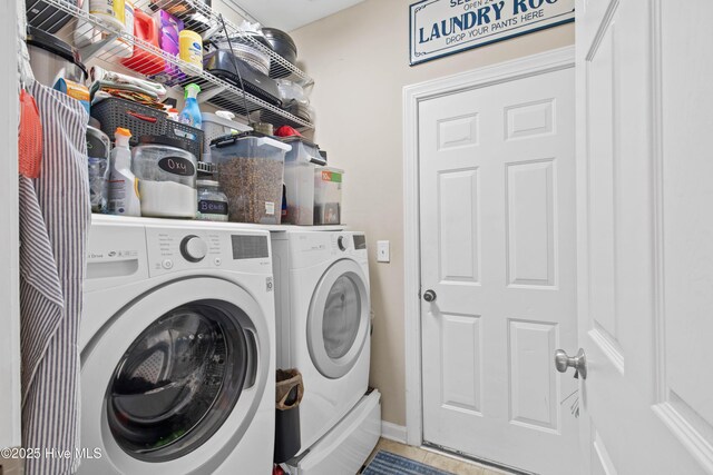 600 Pearson Cir, Newport, NC 28570 - laundry room featuring washing machine and clothes dryer, baseboards, and tile patterned floors