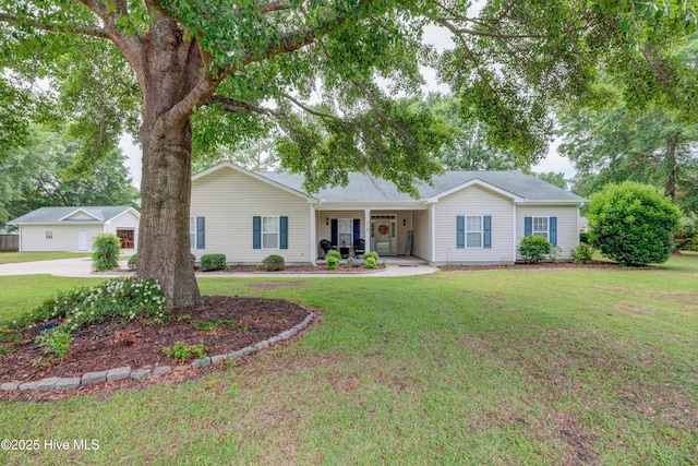 318 Winding Creek Rd, Rocky Point, NC 28457 - ranch-style home featuring a front lawn and a porch