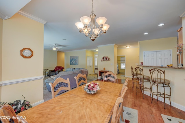 318 Winding Creek Rd, Rocky Point, NC 28457 - dining space featuring crown molding, baseboards, ceiling fan, wood finished floors, and recessed lighting