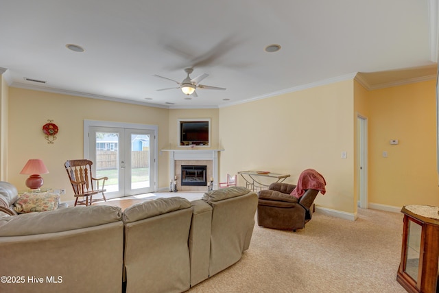 318 Winding Creek Rd, Rocky Point, NC 28457 - living area with ceiling fan, crown molding, light carpet, baseboards, and a fireplace
